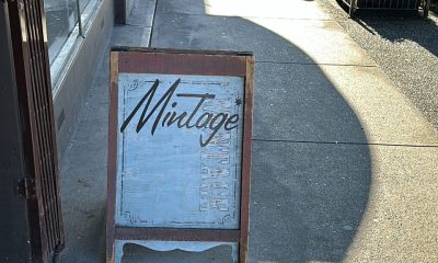 A sign for Mintage Mall on the sidewalk outside the building the business is located in along East Broadway near Kingsway in Vancouver's Mount Pleasant neighbourhood.