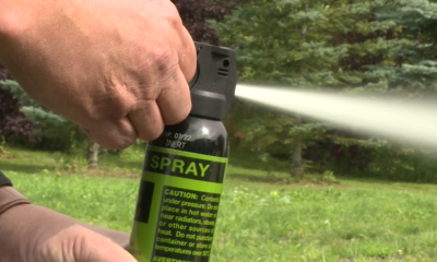 A bear spray canister being deployed