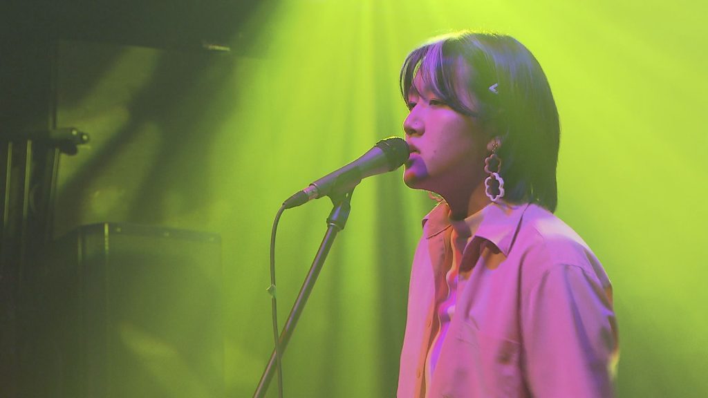 A member of the band Ramen Fog sings onstage at the Fox Cabaret.