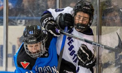 Toronto's Brittany Howard (41) drives Minnesota's Maggie Flaherty (19) into the boards during second period PWHL action in Toronto on Wednesday May 1, 2024