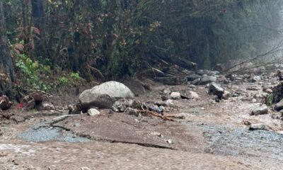 Mudslide debris on a road in the rain