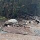 Mudslide debris on a road in the rain