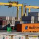 Shipping containers are moved in the Port of Montreal