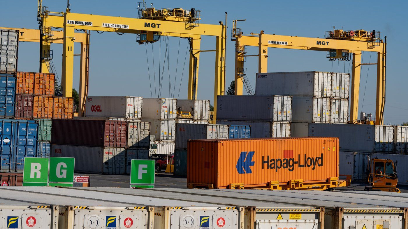 Shipping containers are moved in the Port of Montreal