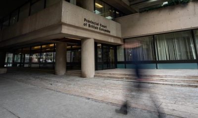 A person walks past the Provincial Court of British Columbia in Vancouver,