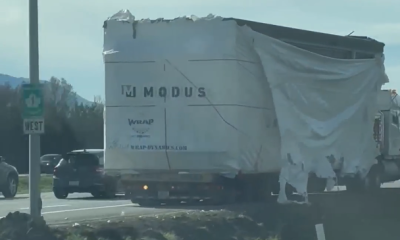 A damaged truck sits idle on Highway 1