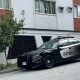 Vancouver Police stationed outside a building near Kingsway and Melbourne Street on Thursday October 3, 2024.