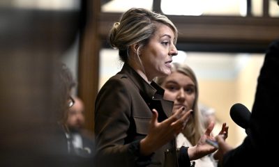 Minister of Foreign Affairs Mélanie Joly takes questions from reporters before a meeting of the Liberal caucus on Parliament Hill in Ottawa on Oct. 9, 2024