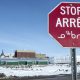 A stop sign in English, French and Inuktut syllabics is seen in Iqaluit, on April 25, 2015