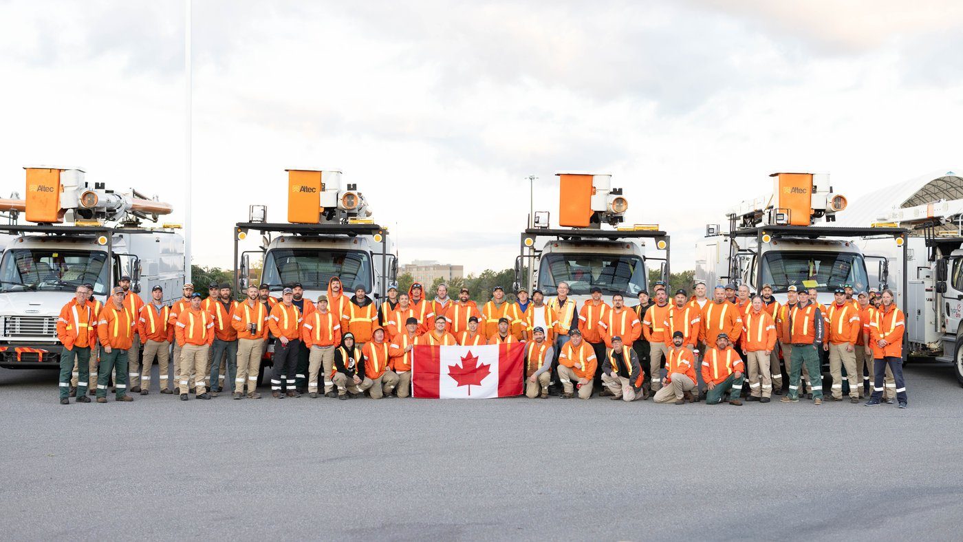 This Oct. 9 handout photo shows Hydro One line workers near the Niagara Falls, Ont., border crossing before heading to Florida to help rebuild power grids after Hurricane Helene and now Milton left millions of Americans in the dark