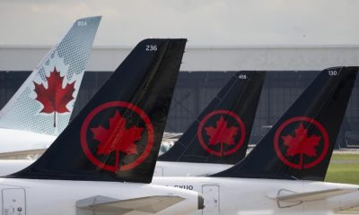 Air Canada logos are seen on the tails of planes at the airport in Montreal