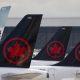 Air Canada logos are seen on the tails of planes at the airport in Montreal