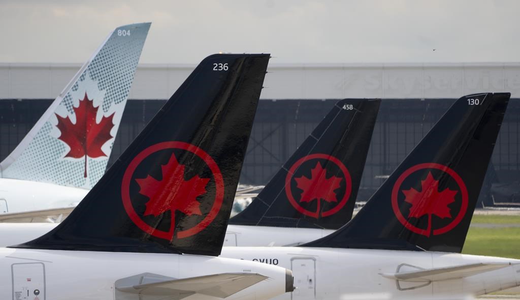 Air Canada logos are seen on the tails of planes at the airport in Montreal