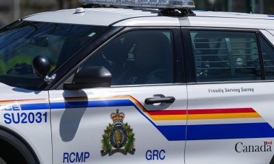 A Surrey RCMP officer drives a police vehicle in Surrey, B.C., on Friday, April 28, 2023. THE CANADIAN PRESS/Darryl Dyck