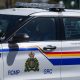 A Surrey RCMP officer drives a police vehicle in Surrey, B.C., on Friday, April 28, 2023. THE CANADIAN PRESS/Darryl Dyck