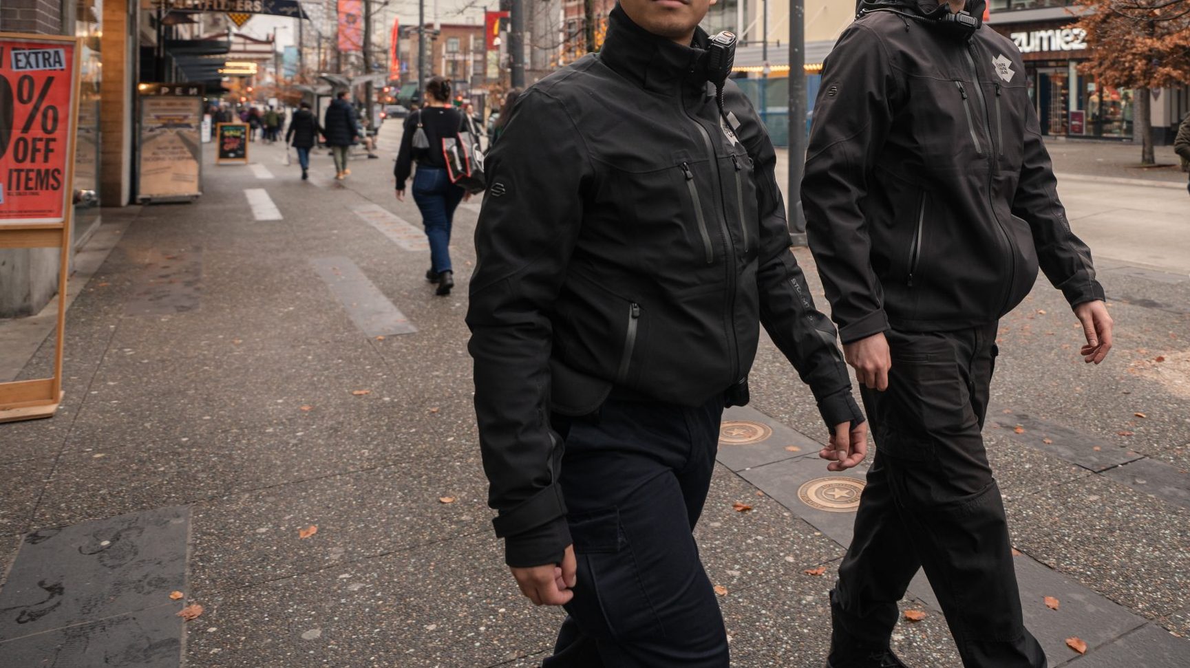 Two DVBIA safety ambassadors walk downtown in Vancouver