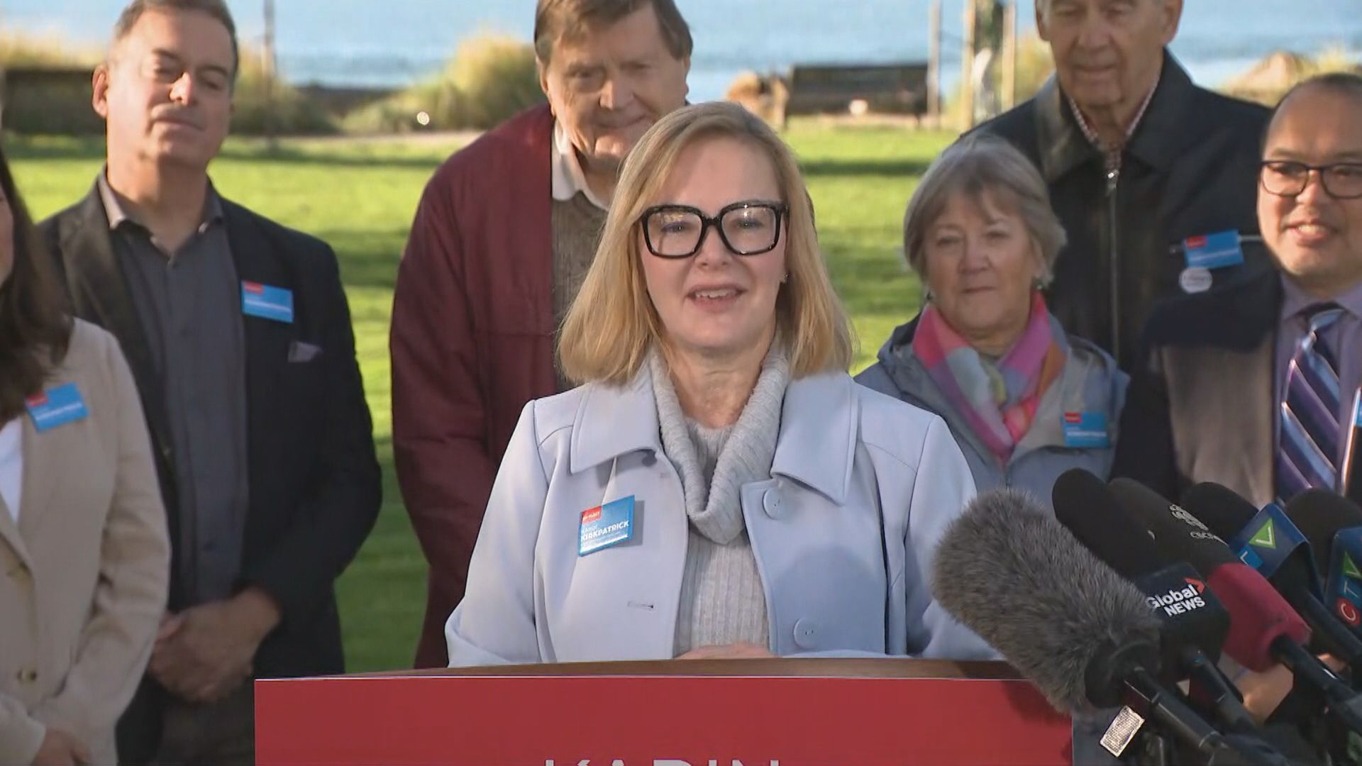 Karin Kirkpatrick speaks at a podium