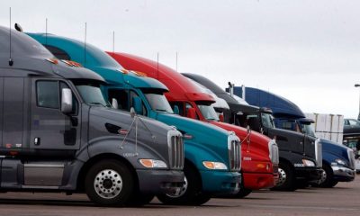 Tractor-trailers parked in a lot