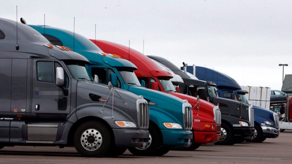 Tractor-trailers parked in a lot