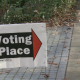 A "voting place" sign on the street