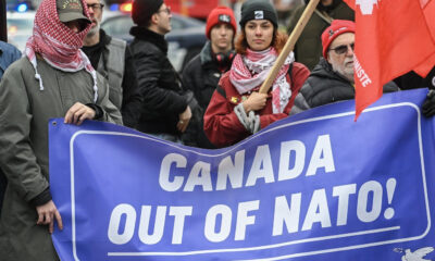 People take part in a protest against NATO in Montreal