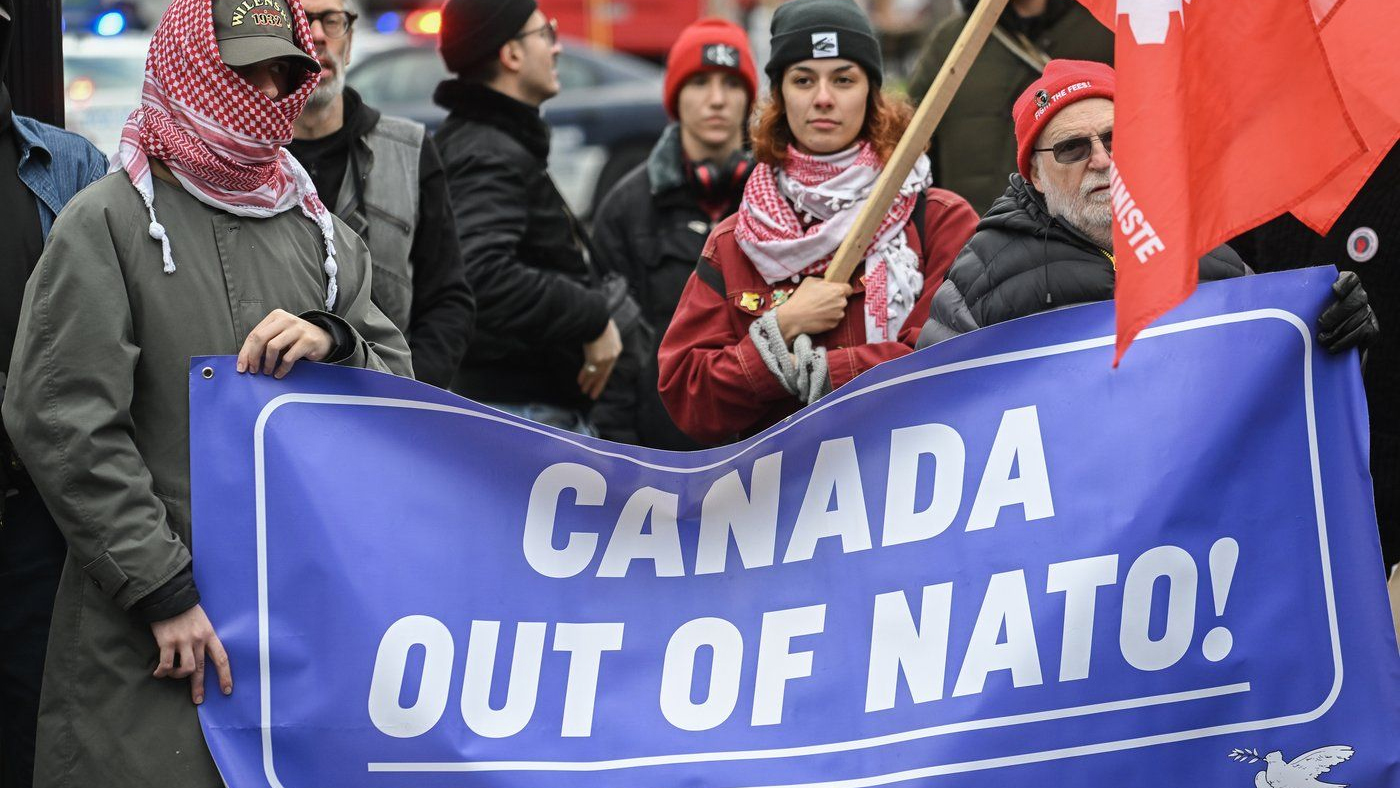 People take part in a protest against NATO in Montreal