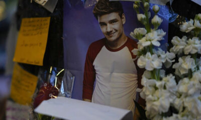 A picture of former One Direction singer Liam Payne adorns a memorial outside the hotel where he was found dead after falling from a balcony in Buenos Aires, Argentina