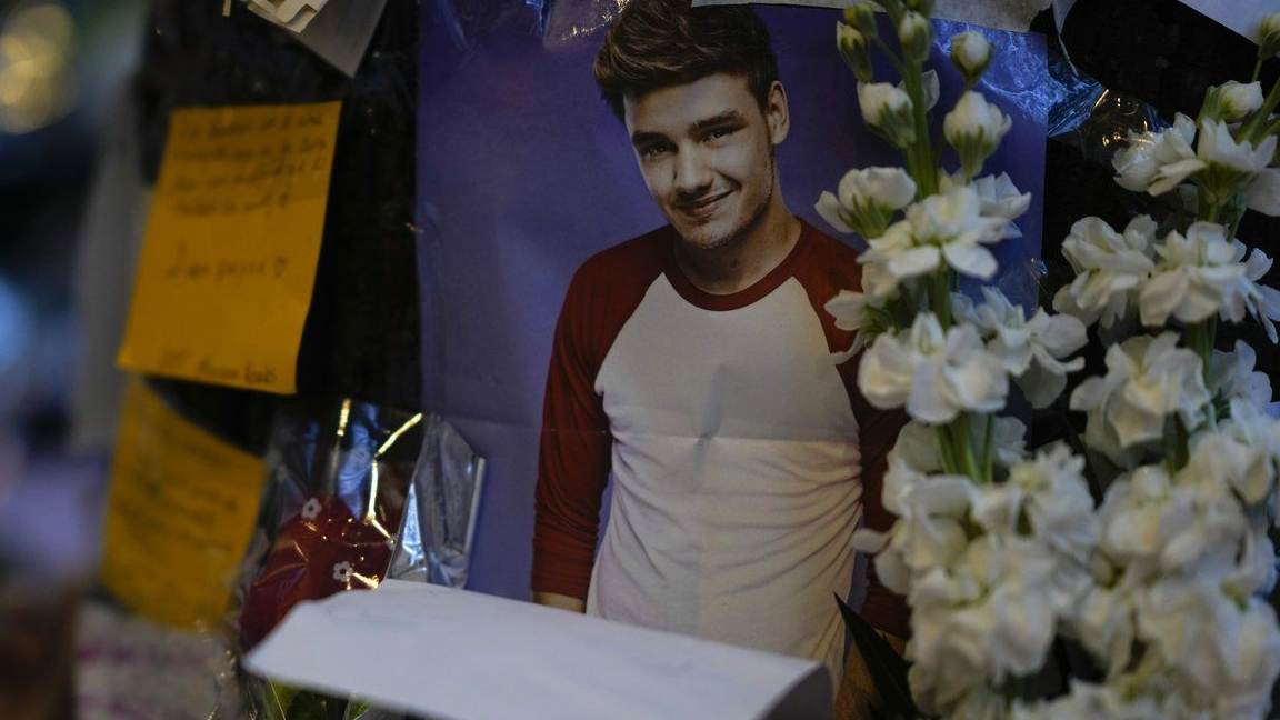 A picture of former One Direction singer Liam Payne adorns a memorial outside the hotel where he was found dead after falling from a balcony in Buenos Aires, Argentina