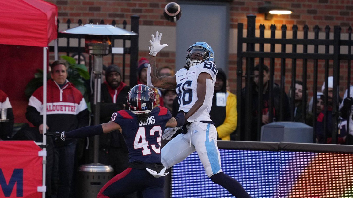 Toronto Argonauts wide receiver Damonte Coxie (86) catches a touchdown as Montreal Alouettes defensive back Lorenzo Burns (43)