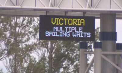 FILE: BC Ferries Tsawwassen terminal sign showing multiple sailing waits.