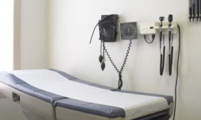 A table at a doctor's office with instruments on the wall