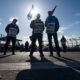 Workers picket at Neptune Terminal during an International Longshore and Warehouse Union labour dispute in North Vancouver, on Tuesday.