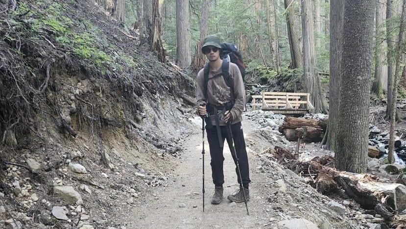 Sam Benastick poses for a photo while hiking