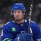 Vancouver Canucks' J.T. Miller prepares to take a faceoff during the second period of an NHL hockey game against the Calgary Flames in Vancouver, on Tuesday, April 16, 2024. (Darryl Dyck/CP)