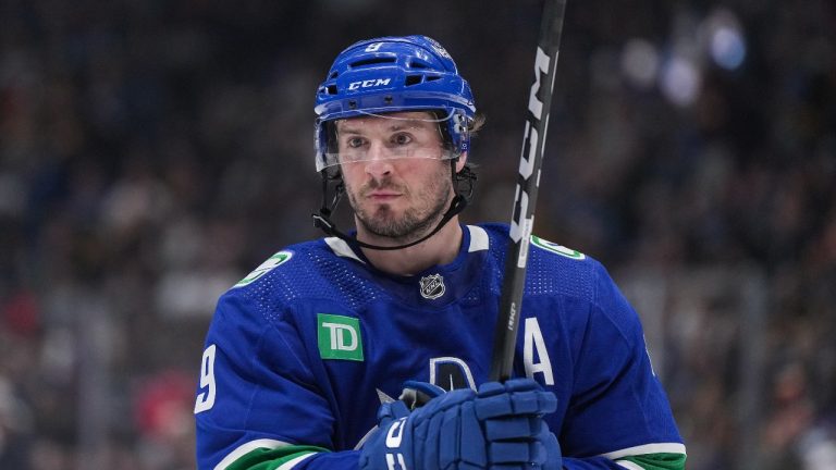 Vancouver Canucks' J.T. Miller prepares to take a faceoff during the second period of an NHL hockey game against the Calgary Flames in Vancouver, on Tuesday, April 16, 2024. (Darryl Dyck/CP)