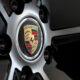 A wheel rim showing the Porsche logo