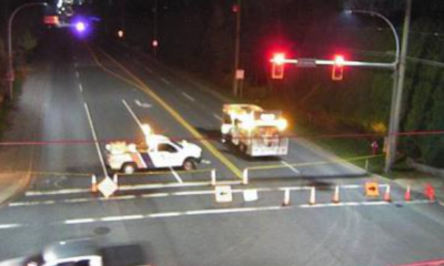 A traffic camera at 176th Street and 24th Avenue shows the road blocked off by emergency vehicles.