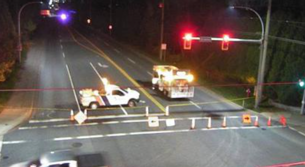 A traffic camera at 176th Street and 24th Avenue shows the road blocked off by emergency vehicles.