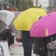 Vancouverites carry colourful umbrellas on a rainy day in April 2024.