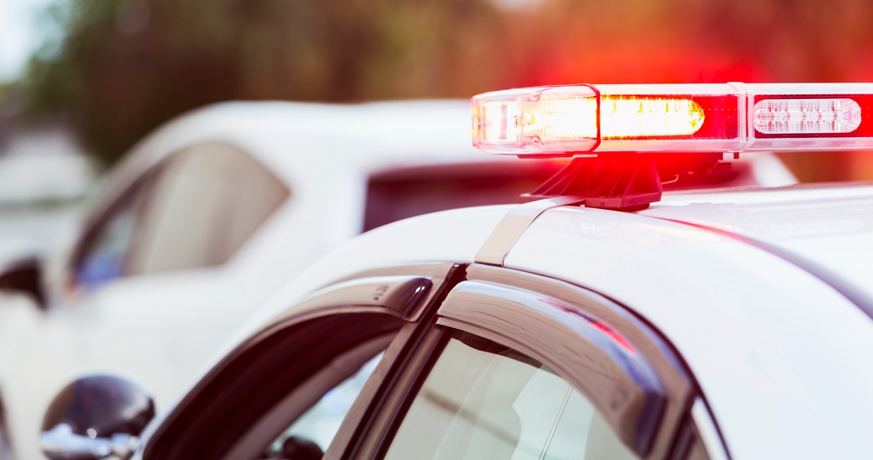 Police lights on the top of a police cruiser.