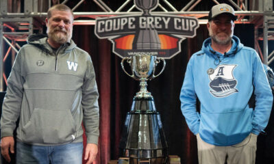 Winnipeg Blue Bombers head coach Mike O'Shea, left, and Toronto Argonauts head coach Ryan Dinwiddie, right