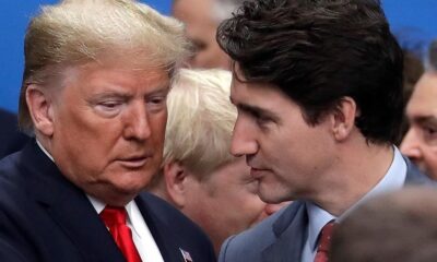 FILE - In this Dec. 4, 2019, file photo, then U.S. President Donald Trump, left, and Canadian Prime Minister Justin Trudeau arrive for a round table meeting during a NATO leaders meeting at The Grove hotel and resort in Watford, Hertfordshire, England