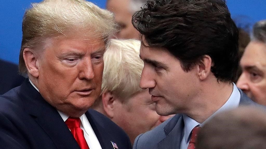 FILE - In this Dec. 4, 2019, file photo, then U.S. President Donald Trump, left, and Canadian Prime Minister Justin Trudeau arrive for a round table meeting during a NATO leaders meeting at The Grove hotel and resort in Watford, Hertfordshire, England