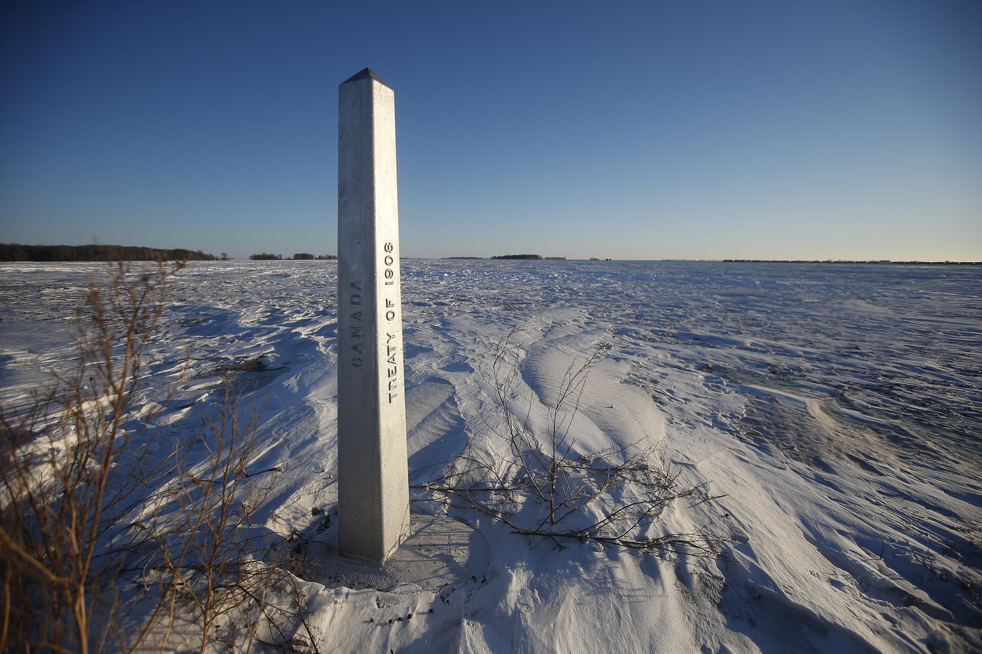 A border marker, between the United States and Canada is shown just outside of Emerson, Manitoba