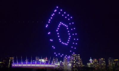 A drone light show flies over BC Place in Vancouver at night