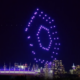 A drone light show flies over BC Place in Vancouver at night