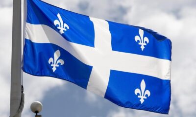 Quebec's provincial flag flies on a flag pole in Ottawa on July 3, 2020