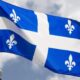 Quebec's provincial flag flies on a flag pole in Ottawa on July 3, 2020