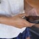 A teenage girl uses her phone to access social media in Sydney on Nov. 8