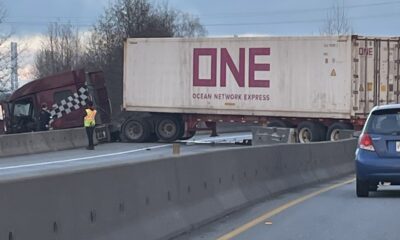 A semi truck blocking lanes of a highway